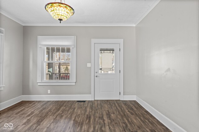 601 Wallace Ave, Indianapolis, IN 46201 - foyer featuring dark wood-style floors, baseboards, ornamental molding, and visible vents