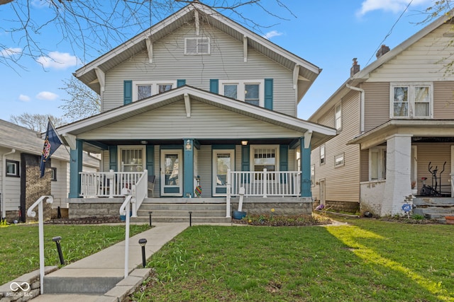 601 Wallace Ave, Indianapolis, IN 46201 - traditional style home with a front yard and a porch