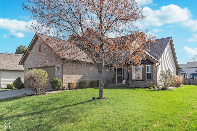 10518 Greenway Dr, Fishers, IN 46037 - view of front of home with a garage, roof with shingles, brick siding, and a front lawn
