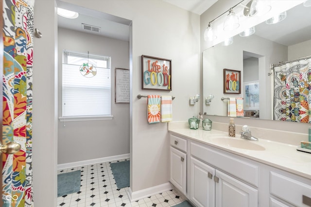 10518 Greenway Dr, Fishers, IN 46037 - bathroom with tile patterned floors, vanity, visible vents, and baseboards