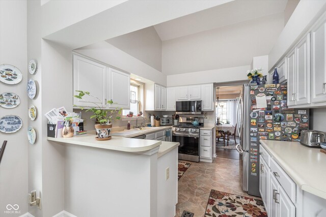 10518 Greenway Dr, Fishers, IN 46037 - kitchen featuring stainless steel appliances, light countertops, a sink, and white cabinetry