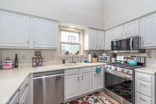 10518 Greenway Dr, Fishers, IN 46037 - kitchen with appliances with stainless steel finishes, a sink, a toaster, and white cabinets