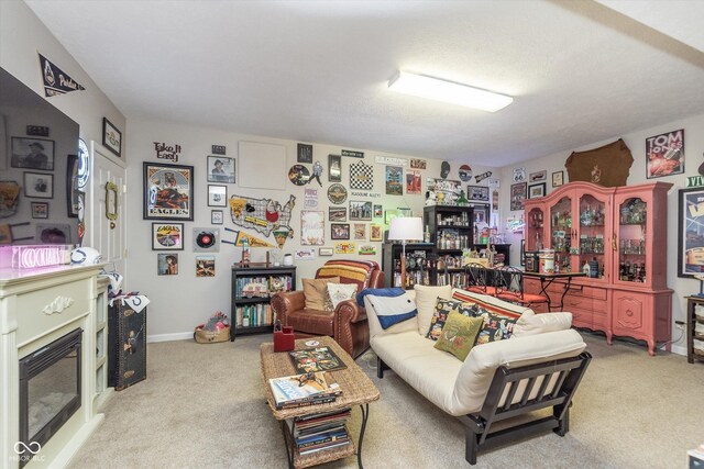 10518 Greenway Dr, Fishers, IN 46037 - carpeted living room with a glass covered fireplace and baseboards