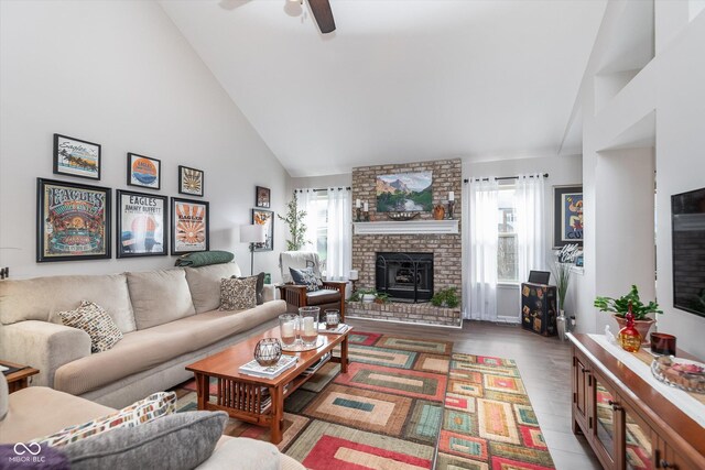 10518 Greenway Dr, Fishers, IN 46037 - living area featuring high vaulted ceiling, a brick fireplace, a ceiling fan, and wood finished floors
