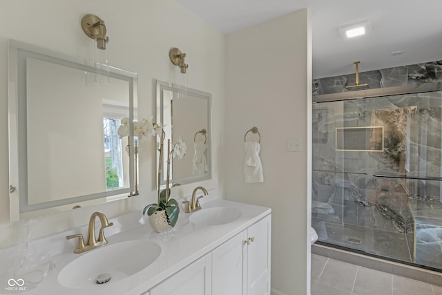 full bath with a shower stall, double vanity, a sink, and tile patterned flooring