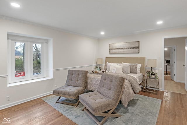 bedroom featuring crown molding, recessed lighting, and wood finished floors