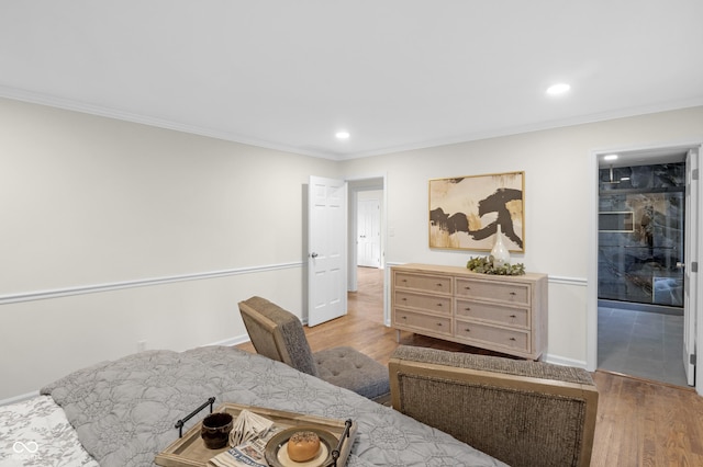 bedroom with ornamental molding, recessed lighting, and wood finished floors