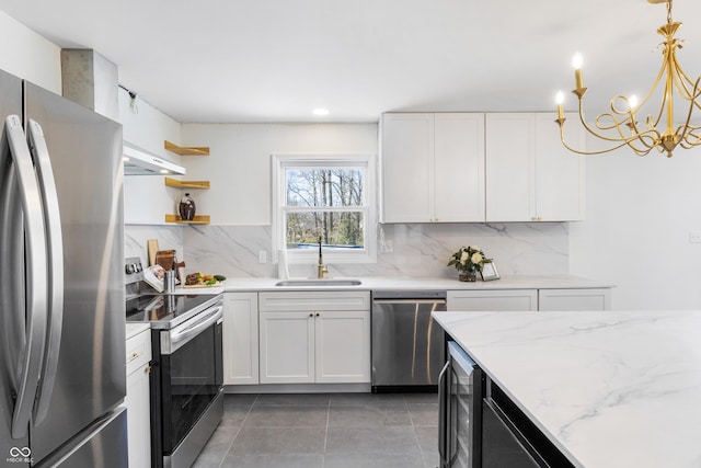 kitchen featuring a sink, appliances with stainless steel finishes, wine cooler, decorative backsplash, and light tile patterned flooring
