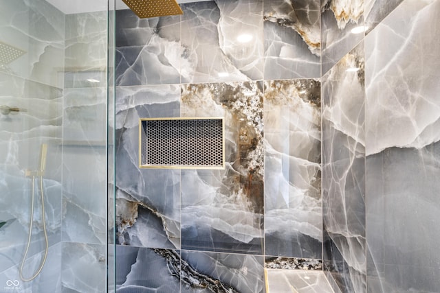 room details with a marble finish shower