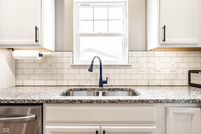 1603 E Market St, Indianapolis, IN 46201 - kitchen featuring a sink, white cabinets, and dishwasher