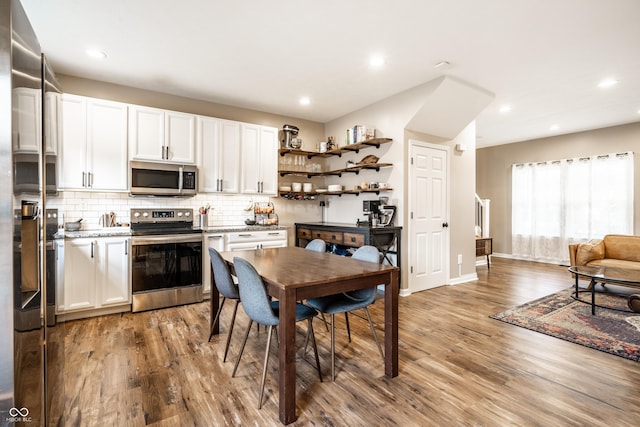 1603 E Market St, Indianapolis, IN 46201 - dining room with light wood-style flooring, baseboards, and recessed lighting