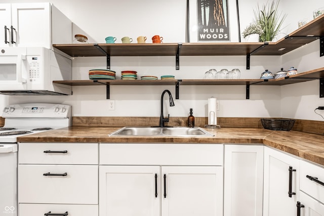 1603 E Market St, Indianapolis, IN 46201 - kitchen with butcher block countertops, white appliances, a sink, and open shelves