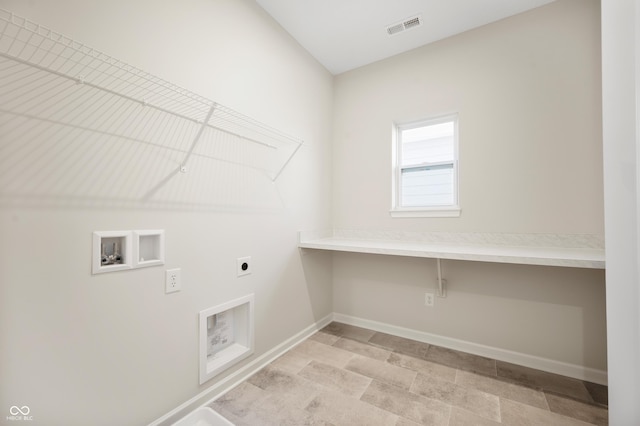 clothes washing area featuring laundry area, electric dryer hookup, visible vents, washer hookup, and baseboards