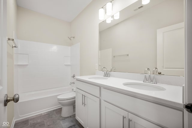 full bathroom featuring double vanity, visible vents, a sink, and toilet