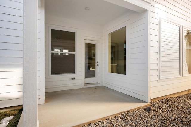 doorway to property featuring a patio area
