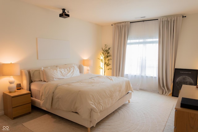 bedroom with light carpet