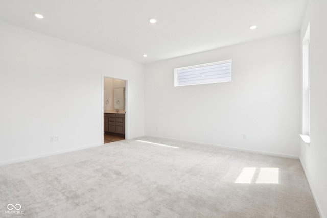 carpeted empty room with recessed lighting and baseboards