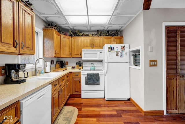 10495 Deer Run Rd, Poland, IN 47868 - kitchen with light countertops, a sink, white appliances, and light wood-style floors