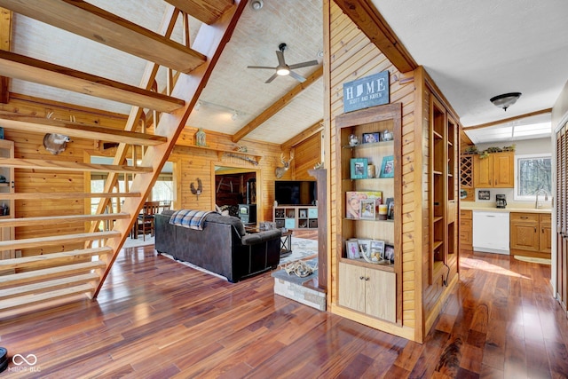 10495 Deer Run Rd, Poland, IN 47868 - living room featuring wooden walls, a ceiling fan, hardwood / wood-style flooring, and lofted ceiling with beams