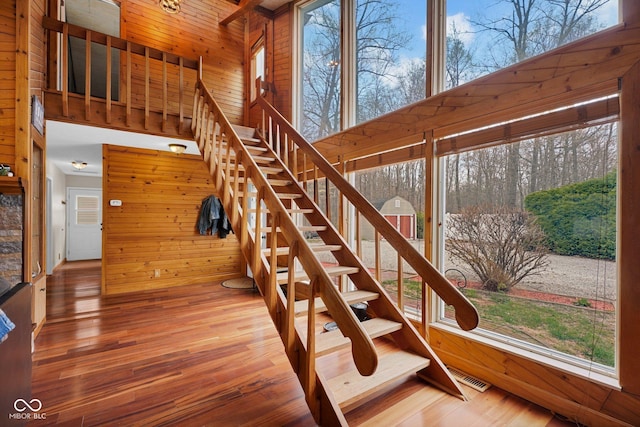 10495 Deer Run Rd, Poland, IN 47868 - stairway with wood finished floors, wooden walls, and visible vents