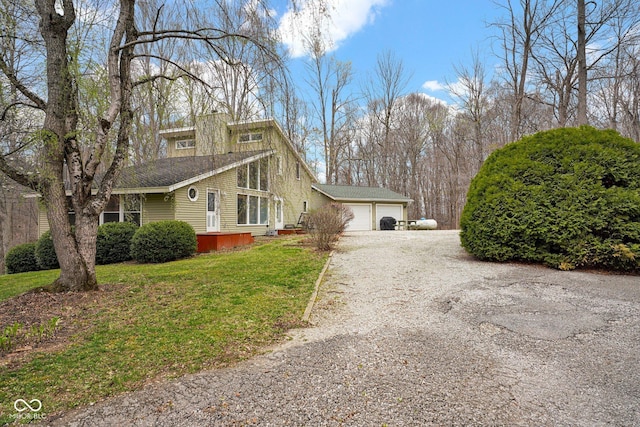 10495 Deer Run Rd, Poland, IN 47868 - view of side of home featuring a lawn, driveway, and a garage