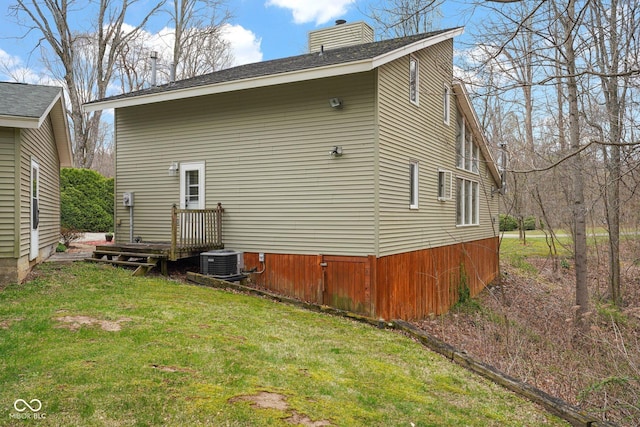10495 Deer Run Rd, Poland, IN 47868 - view of home's exterior featuring a yard, central air condition unit, and a chimney