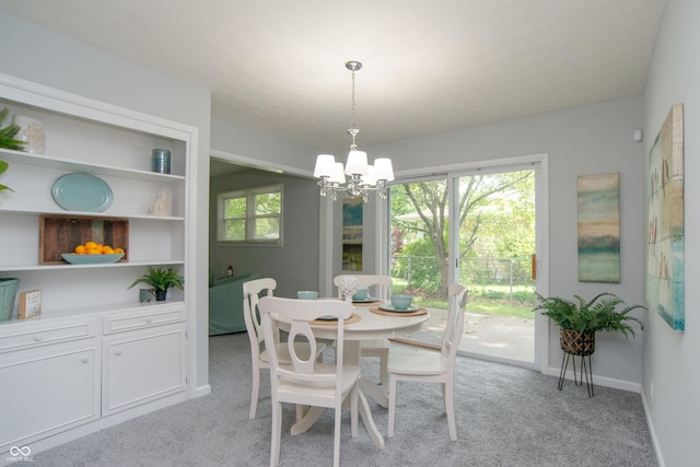 3140 Bonham Dr, Indianapolis, IN 46222 - dining space featuring a chandelier, light carpet, and baseboards
