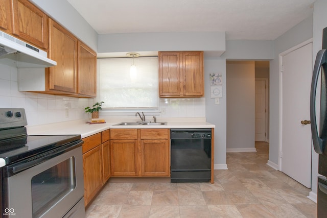3140 Bonham Dr, Indianapolis, IN 46222 - kitchen with black appliances, a sink, under cabinet range hood, tasteful backsplash, and light countertops