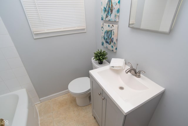 3140 Bonham Dr, Indianapolis, IN 46222 - full bath with toilet, vanity, tile patterned floors, and baseboards