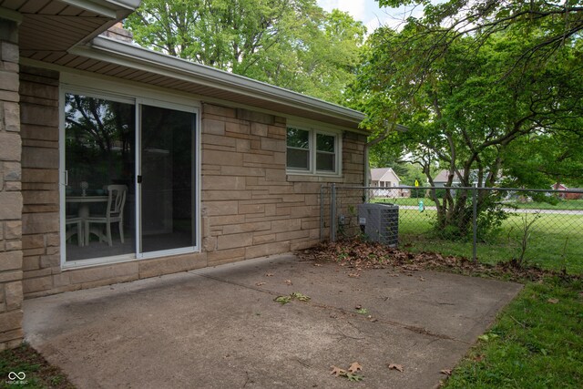 3140 Bonham Dr, Indianapolis, IN 46222 - view of patio / terrace featuring central air condition unit