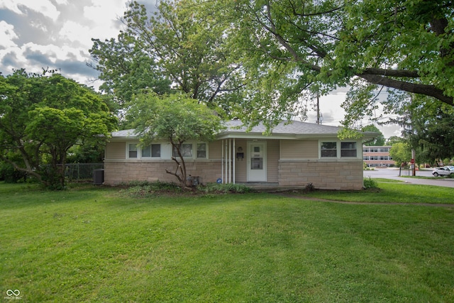 3140 Bonham Dr, Indianapolis, IN 46222 - view of front facade featuring stone siding and central air condition unit