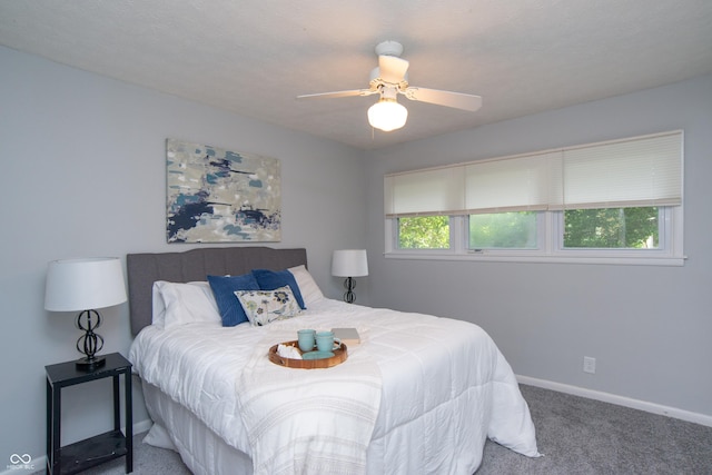 3140 Bonham Dr, Indianapolis, IN 46222 - carpeted bedroom with baseboards and ceiling fan