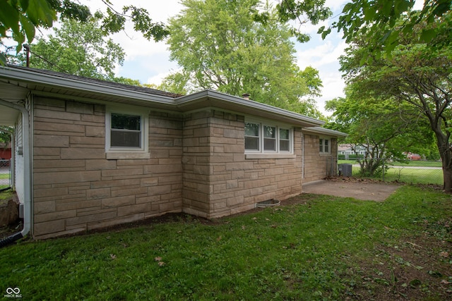 3140 Bonham Dr, Indianapolis, IN 46222 - view of home's exterior with stone siding