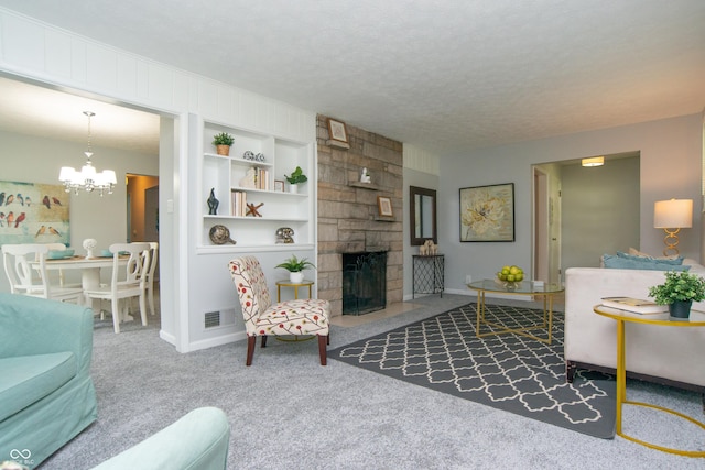 3140 Bonham Dr, Indianapolis, IN 46222 - carpeted living room featuring a chandelier, a stone fireplace, baseboards, a textured ceiling, and built in features