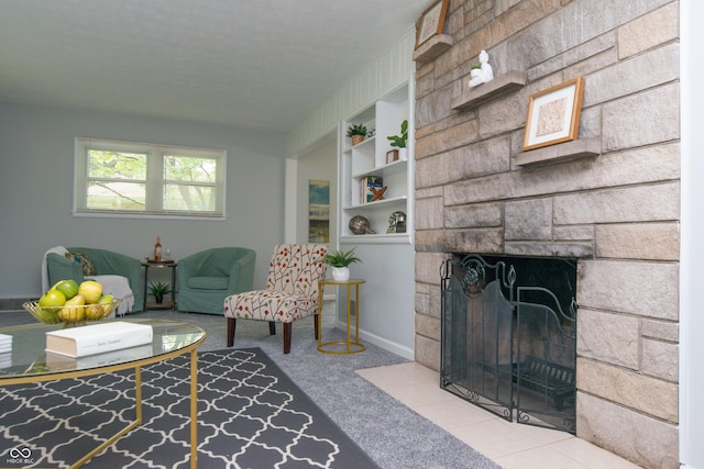 3140 Bonham Dr, Indianapolis, IN 46222 - carpeted living room with a stone fireplace, built in shelves, and baseboards