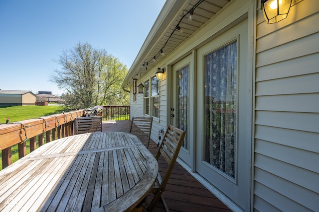deck with outdoor dining area