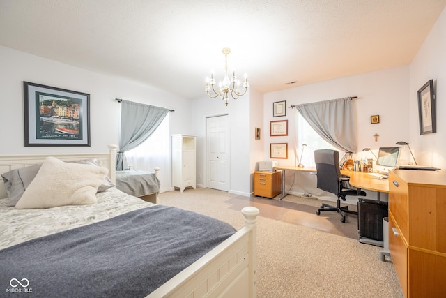 bedroom with light carpet, a notable chandelier, visible vents, and a closet