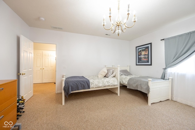 bedroom featuring light carpet, baseboards, visible vents, and a chandelier