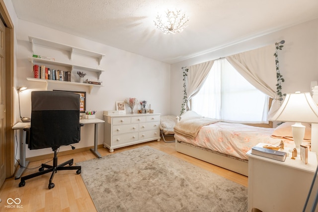 bedroom featuring light wood finished floors
