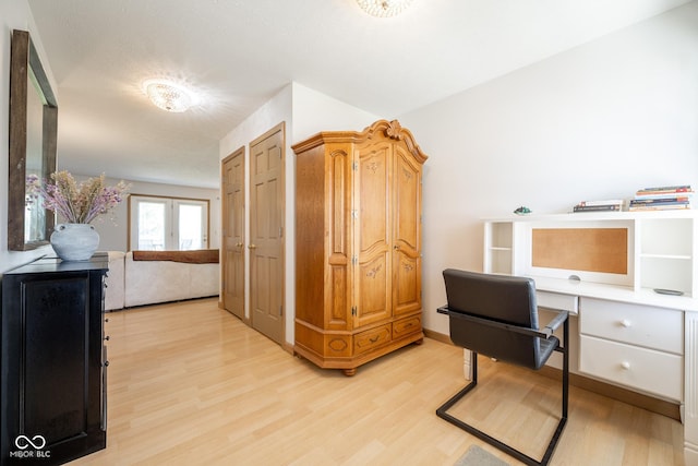 office featuring light wood-type flooring and french doors