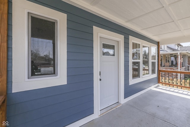 doorway to property featuring a porch