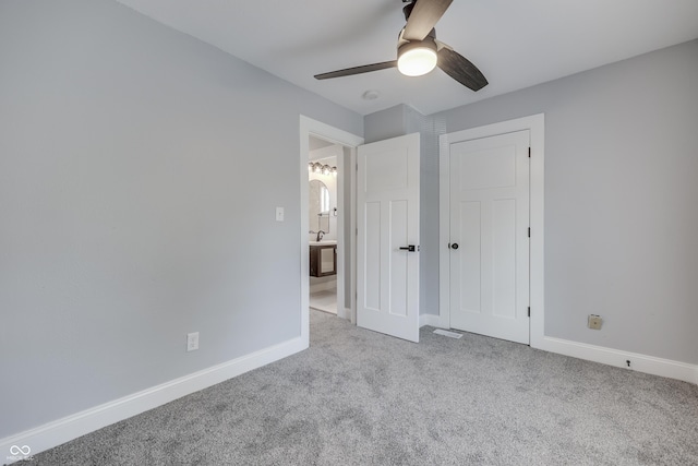 unfurnished bedroom with baseboards, carpet flooring, and ceiling fan