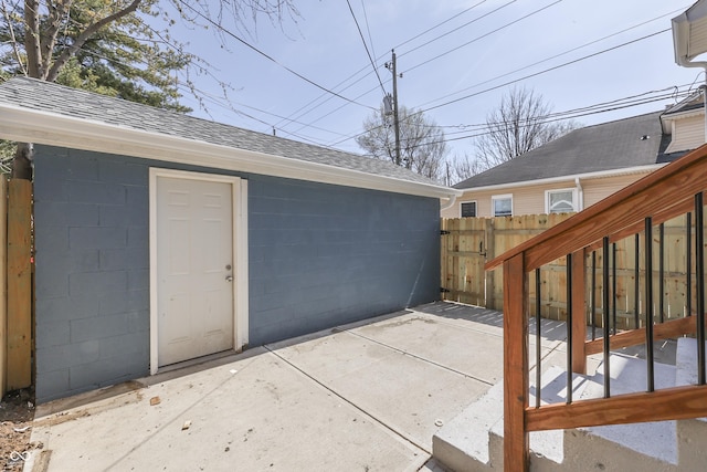 exterior space featuring an outdoor structure and fence