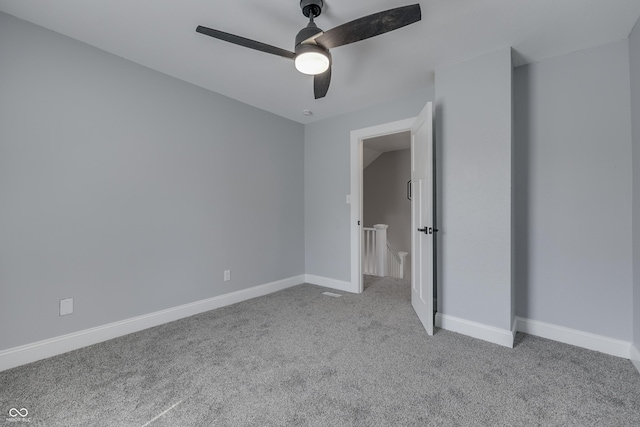 unfurnished bedroom featuring carpet flooring, baseboards, and ceiling fan