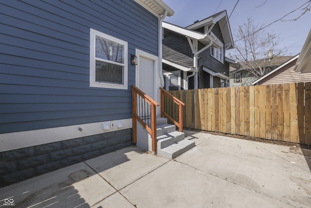 view of patio / terrace with entry steps and fence