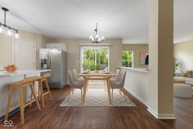 518 Carthage Cir, Westfield, IN 46074 - dining room with a chandelier, dark wood-type flooring, baseboards, and a textured ceiling