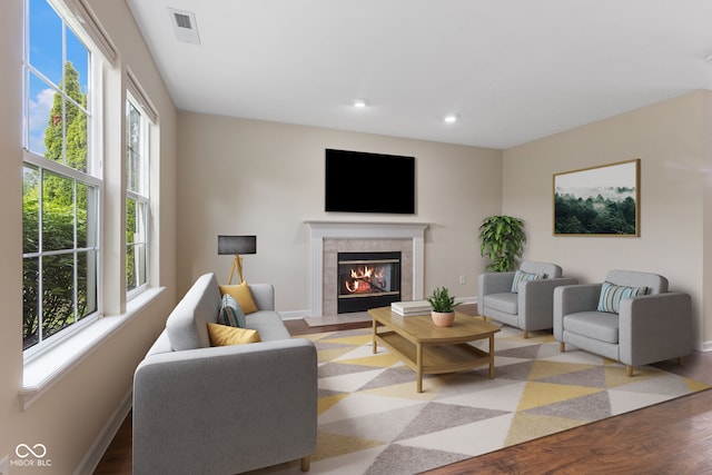 518 Carthage Cir, Westfield, IN 46074 - living area with healthy amount of natural light, baseboards, a tiled fireplace, recessed lighting, and wood finished floors