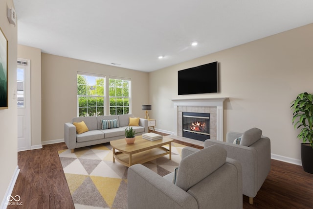 518 Carthage Cir, Westfield, IN 46074 - living area featuring wood finished floors, a tiled fireplace, baseboards, and recessed lighting