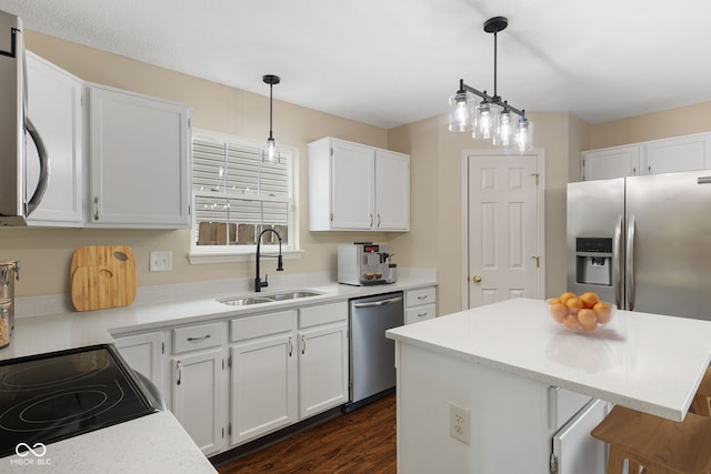 518 Carthage Cir, Westfield, IN 46074 - kitchen with a sink, appliances with stainless steel finishes, white cabinetry, dark wood finished floors, and light countertops