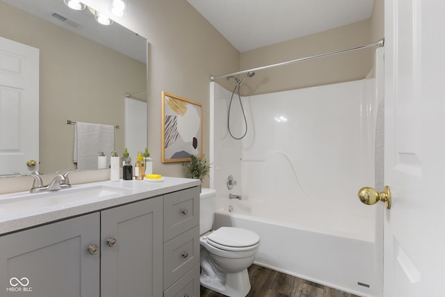 518 Carthage Cir, Westfield, IN 46074 - bathroom featuring wood finished floors, vanity, toilet, and shower / bathtub combination